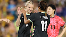 Kaitlin Torpey celebrates with Mary Fowler. 