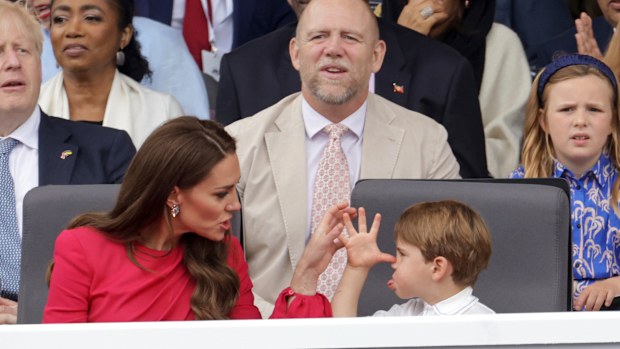 Kate, Duchess of Cambridge, left speaks with Prince Louis, during the Platinum Jubilee Pageant, in London, Sunday June 5, 2022, on the last of four days of celebrations to mark the Platinum Jubilee.  