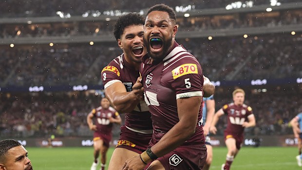 Hamiso Tabuai-Fidow of the Maroons celebrates with Robert Toia after scoring his second try.