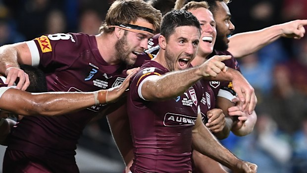 Ben Hunt celebrates with his Queensland Maroons teammates.