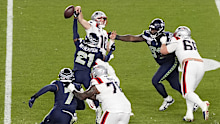 SANTA CLARA, CALIFORNIA - FEBRUARY 08: Devon Witherspoon #21 of the Seattle Seahawks forces a fumble against Drake Maye #10 of the New England Patriots during the fourth quarter in Super Bowl LX at Levi's Stadium on February 08, 2026 in Santa Clara, California.  (Photo by Thearon W. Henderson/Getty Images)