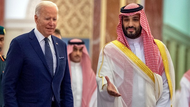 In this photo released by the Saudi Royal Palace, Saudi Crown Prince Mohammed bin Salman, right, welcomes President Joe Biden upon his arrival at Al-Salam palace in Jeddah, Saudi Arabia, Friday, July 15, 2022. (Bandar Aljaloud/Saudi Royal Palace via AP)