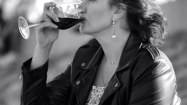 Stock image of a woman drinking wine.
