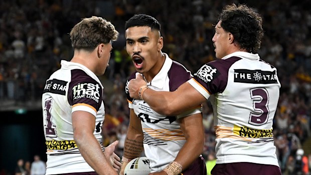The Brisbane Broncos celebrate a try.