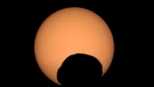 NASA's Perseverance rover captured the silhouette of the Martian moon Phobos as it passed in front of the Sun on September 30. The video shows the transit speeded up by four times, followed by the eclipse in real time.