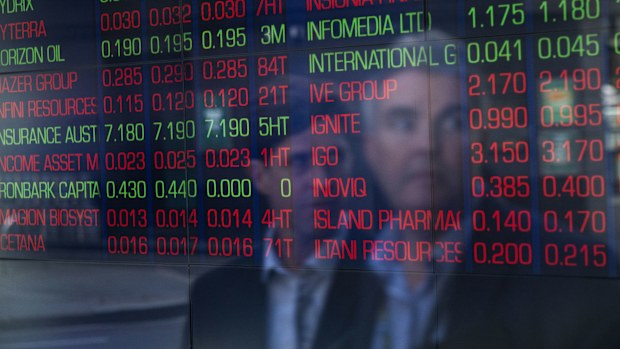 A screen at the Australian Stock Exchange showing many shares in the red.