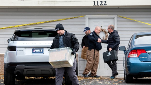 Officers investigate the deaths of four University of Idaho students at an apartment complex south of campus on Monday, November 14, 2022, in Moscow, Idaho. 