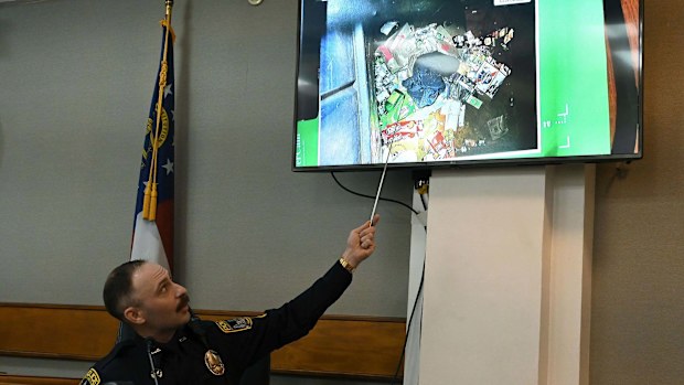 Athens-Clarke County police officer Zachary Davis points out the jacket he collected from a dumpster as he testifies during a trial of Jose Ibarra on November 15.Mandatory Credit:	Hyosub Shin/Pool/Atlanta Journal-Constitution/AP via CNN Newsource