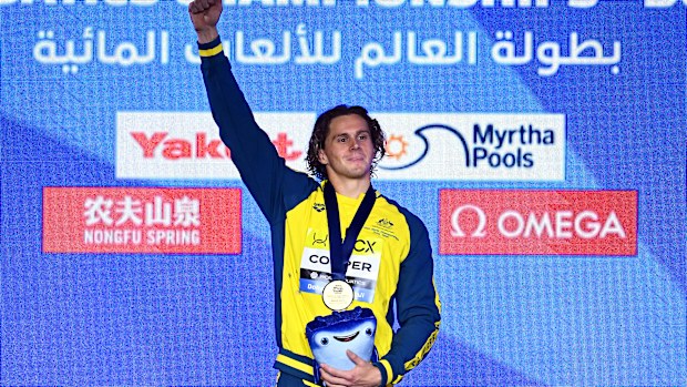 Isaac Cooper celebrates his World Aquatics Championships gold medal.