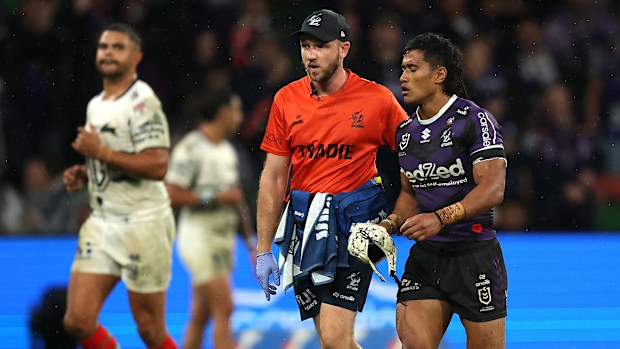 Sualauvi Faalogo of the Storm is assisted off the field for a Head Injury Assessment (HIA) after being tackled high by Latrell Mitchell of the Rabbitohs during the round eight NRL match between the Melbourne Storm and South Sydney Rabbitohs at AAMI Park on April 25, 2025, in Melbourne, Australia. (Photo by Robert Cianflone/Getty Images)
