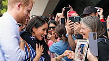 Michelle Heywood greeted Prince Harry at the Sydney Opera house with a photo of her late "super fan" mother.