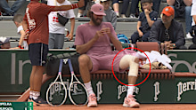 Reilly Opelka sits between points.