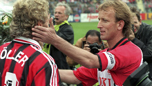Andreas Brehme (right) and Leverkusen's Rudi Voeller in 1996.