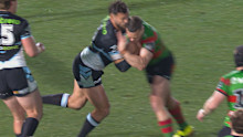 Toby Rudolf of the Sharks and Jack Wighton of the Rabbitohs collide.