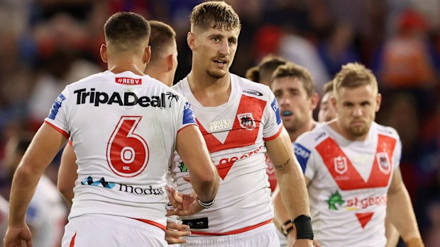 Zac Lomax and Corey Norman celebrate a Dragons try against the Knights.