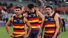 ADELAIDE, AUSTRALIA - MAY 12: Crows players Josh Rachele, Izak Rankine and Darcy Fogarty walk off after the draw during the 2024 AFL Round 09 match between the Adelaide Crows and the Brisbane Lions at Adelaide Oval on May 12, 2024 in Adelaide, Australia. (Photo by Sarah Reed/AFL Photos via Getty Images)