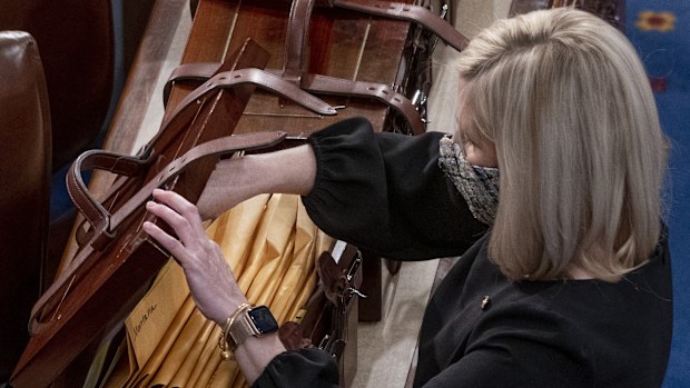 Boxes containing Electoral College votes are opened as a joint session of the House and Senate
