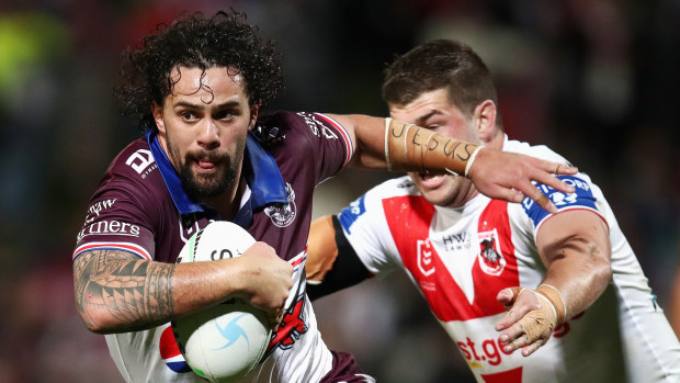 Josh Aloiai of the Sea Eagles is tackled during the 2022 round 19 NRL match between the St George Illawarra and Manly.