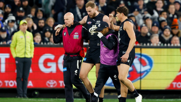 MELBOURNE, AUSTRALIA - SEPTEMBER 08: Harry McKay of the Blues is seen being assisted off the ground by medical staff during the 2023 AFL First Elimination Final match between the Carlton Blues and the Sydney Swans at Melbourne Cricket Ground on September 08, 2023 in Melbourne, Australia. (Photo by Dylan Burns/AFL Photos via Getty Images)