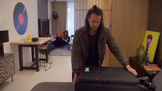 Jesse packing his bags to move out.