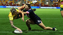 Julia Robinson goes over to score the Jillaroos' hat trick try against the Kiwi ferns.