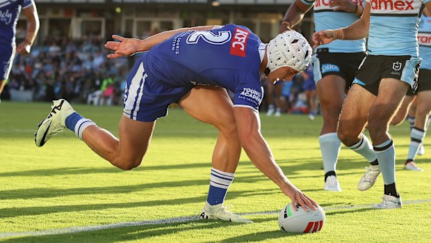 Blake Wilson of the Bulldogs scores a try during the round two NRL match between Cronulla Sharks and Canterbury Bulldogs at PointsBet Stadium on March 15, 2024, in Sydney, Australia. (Photo by Mark Metcalfe/Getty Images)