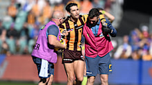 Hawthorn's Chad Wingard is helped from the field after suffering an Achilles injury in round 22.