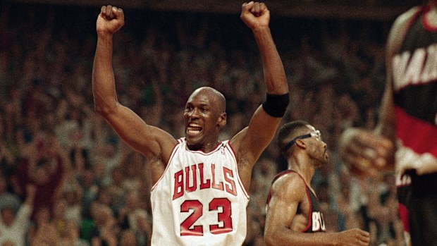 Michael Jordan celebrates the Bulls win over the Portland Trail Blazers in the NBA Finals in Chicago on June 14, 1992. (AP Photo/John Swart, File)