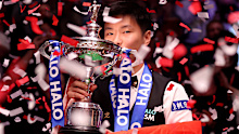 Zhao Xintong of China poses for a photo with the Halo World Snooker Championship trophy after after defeating Mark Williams of Wales (not pictured) in the Final match between Mark Williams of Wales and Zhao Xintong of China on  day seventeen of the Halo World Snooker Championship 2025 at Crucible Theatre on May 05, 2025 in Sheffield, England. (Photo by George Wood/Getty Images)