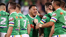 Josh Papalii celebrates a try with teammates.