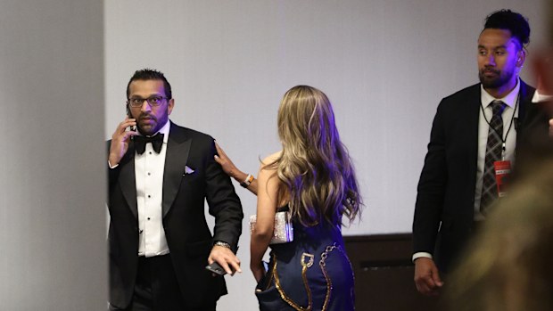 FBI director Kash Patel talks on the phone during the White House Correspondents Dinner.