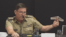 Lieutenant Colonel Brendan Reinhardt used a paper aeroplane to explain the aviation concept during the inquiry.