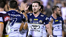 Cowboys star Michael Morgan celebrates a try with Jake Clifford during a 2021 pre-season game.