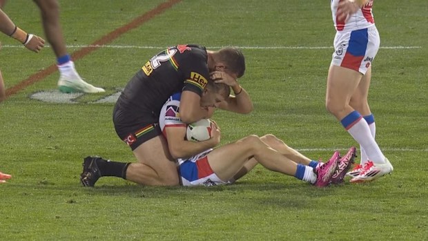 Liam Henry performing a crusher tackle on Fletcher Sharpe.