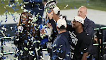 SANTA CLARA, CALIFORNIA - FEBRUARY 08: Head coach Mike MacDonald of the Seattle Seahawks hoists the Vince Lombardi Trophy with palyers after defeating the New England Patriots 29-13 to win  Super Bowl LX at Levi's Stadium on February 08, 2026 in Santa Clara, California.  (Photo by Thearon W. Henderson/Getty Images)