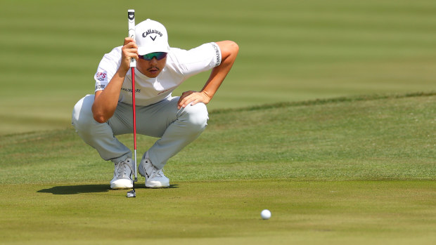 Min Woo Lee of Australia lines up a putt on the 11th green during the second round of THE PLAYERS Championship on THE PLAYERS Stadium Course at TPC Sawgrass on March 10, 2023 in Ponte Vedra Beach, Florida. (Photo by Mike Ehrmann/Getty Images)