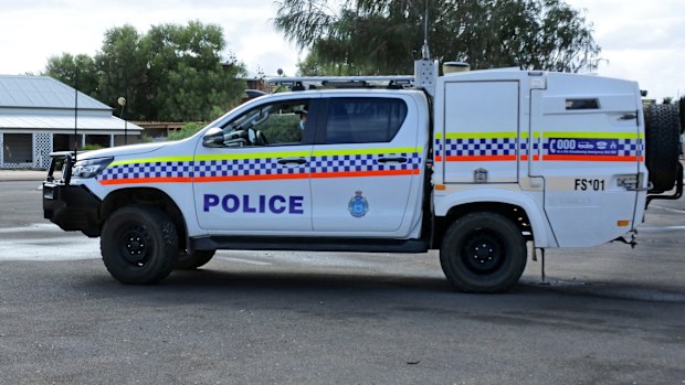 DENHAM, WA - APR 26 2022:Western Australia Police Toyota HiLux police paddy wagon with cage.Police vans are usually employed for prisoners transport or for the rapid transport of a number of officers.