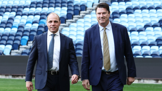 Rugby Australia CEO Phil Waugh walks next to chairman Hamish McLennan.