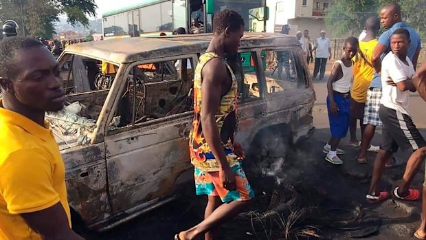 People gather at the scene of a tanker explosion after it was struck by a truck in the Wellington suburb of Sierra Leone's capital Freetown.