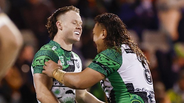 Josh Papali'i celebrates with Ethan Strange after the latter scored a try.