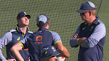 Steve Smith looks disappointed during a conversation with Andrew McDonald and Pat Cummins. 