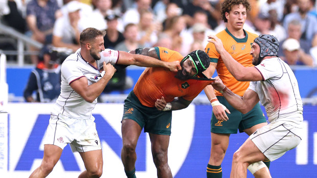 Marika Koroibete of Australia fights with Demur Tapladze and Beka Gorgadze of Georgia.