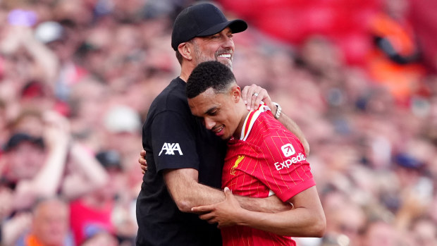 Liverpool's Trent Alexander-Arnold hugs outgoing manager Jurgen Klopp after being substituted during the Premier League match at Anfield.