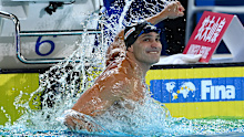 Nicholas Santos celebrates winning the men's 50m Butterfly final.