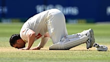 Travis Head kisses the turf. 