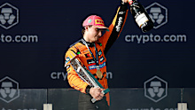 Race winner Oscar Piastri of Australia and McLaren leaves the podium with his trophy during the F1 Grand Prix of Miami.