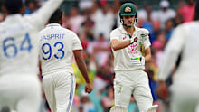 India celebrate around Sam Konstas on day one. 