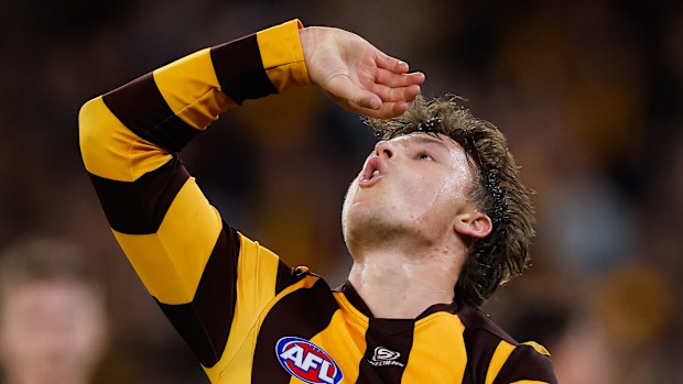 Jack Ginnivan of the Hawks celebrates a goal with a beer drinking ode to his antics at the pub on Thursday night.