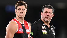 MELBOURNE, AUSTRALIA - MARCH 05: Jack Steele of the Saints and Saints head coach Brett Ratten stand for a minute silence for Shane Warne during the AFL AAMI Community Series match between the Essendon Bombers and the St Kilda Saints at Marvel Stadium on March 05, 2022 in Melbourne, Australia. (Photo by Quinn Rooney/Getty Images)