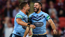 Tariq Sims and James Tedesco celebrate a NSW Blues victory.